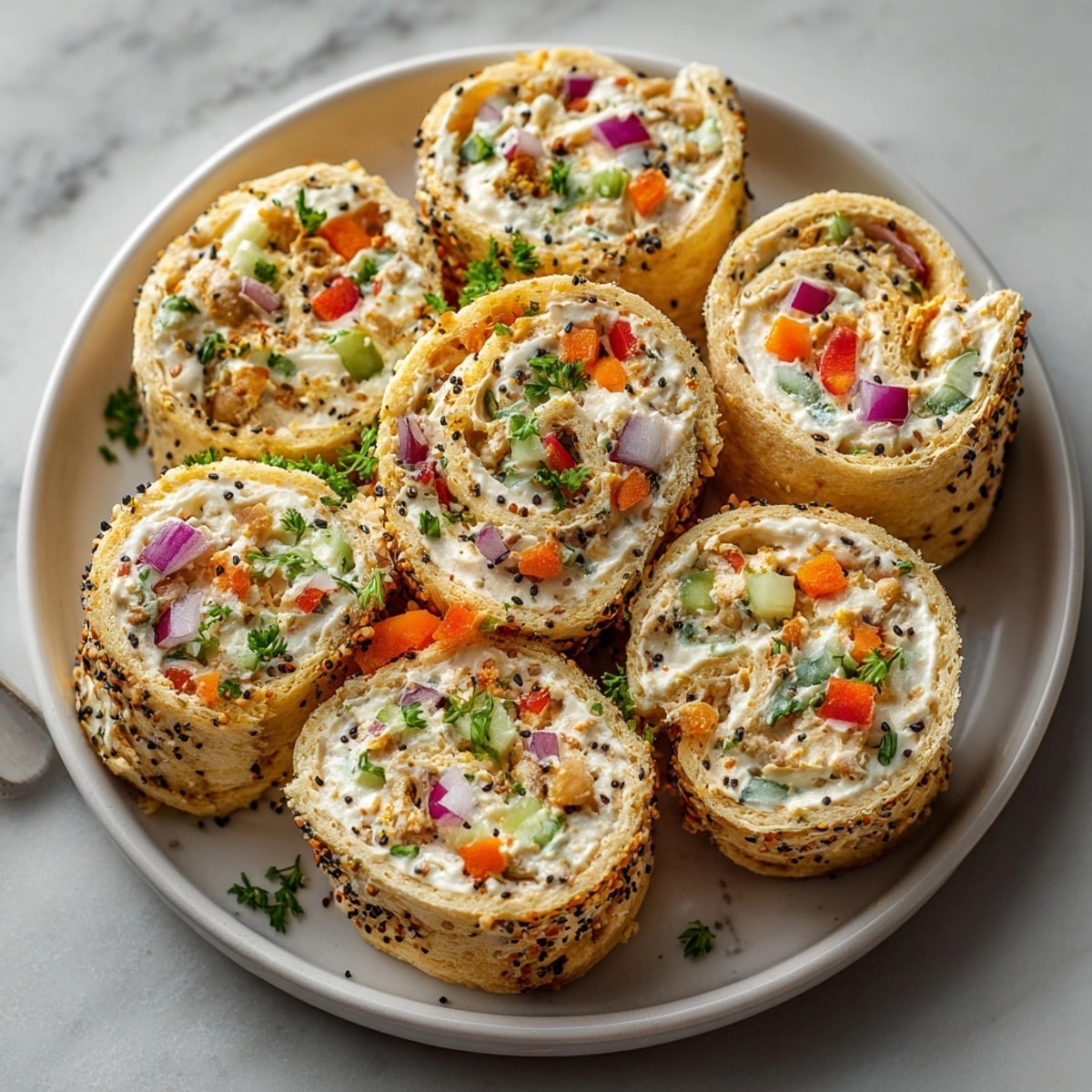 Savory Everything Bagel Chickpea Salad Pinwheels, golden brown and flaky, ready for lunch.