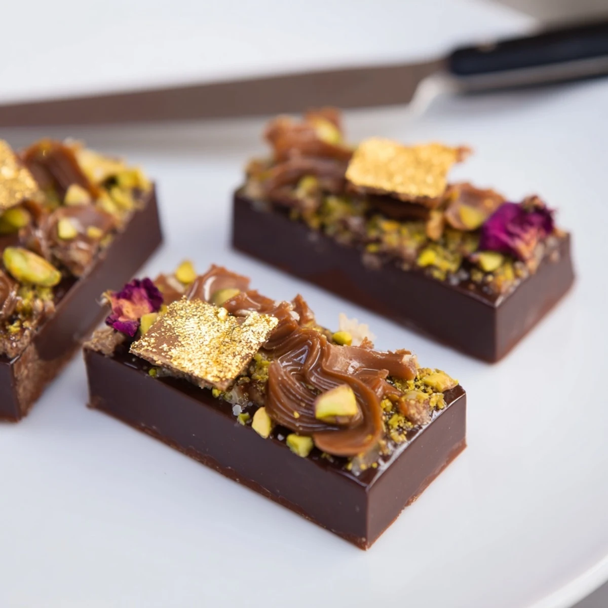 Luxurious chocolate bar inspired creations highlighted by spiced date caramel and pistachios.  