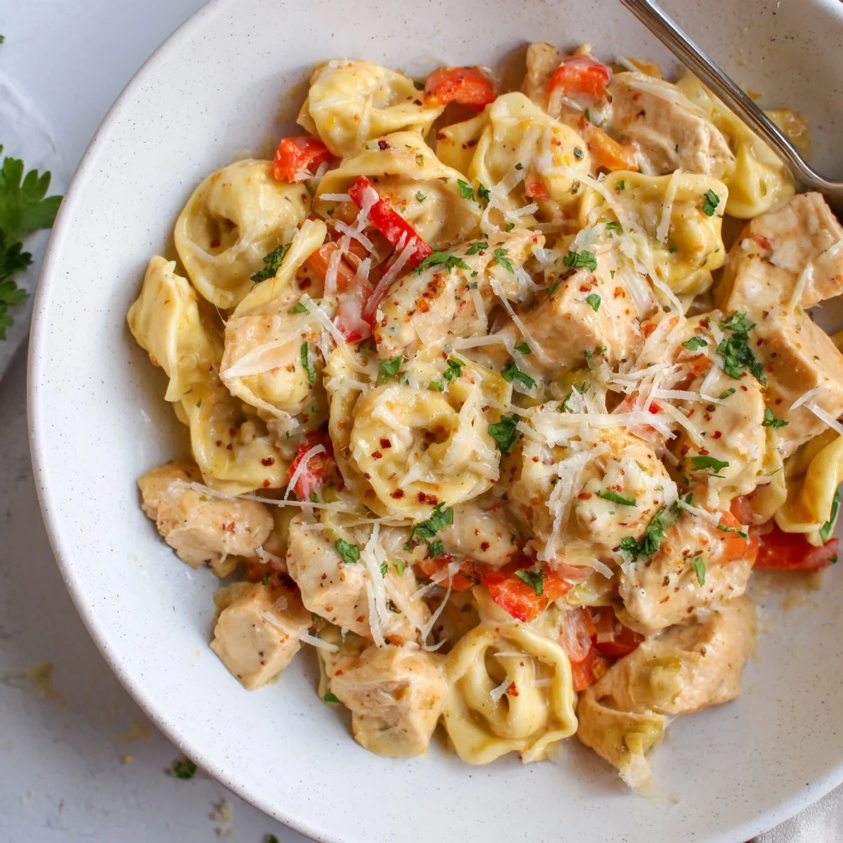 Creamy Zesty Cajun Garlic Parmesan Chicken Tortellini in a vibrant sauce  