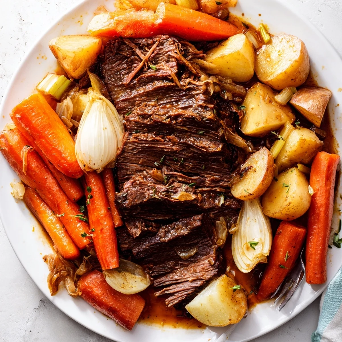 Tender Sunday Pot Roast with roasted veggies, ideal for cozy family dinners.  