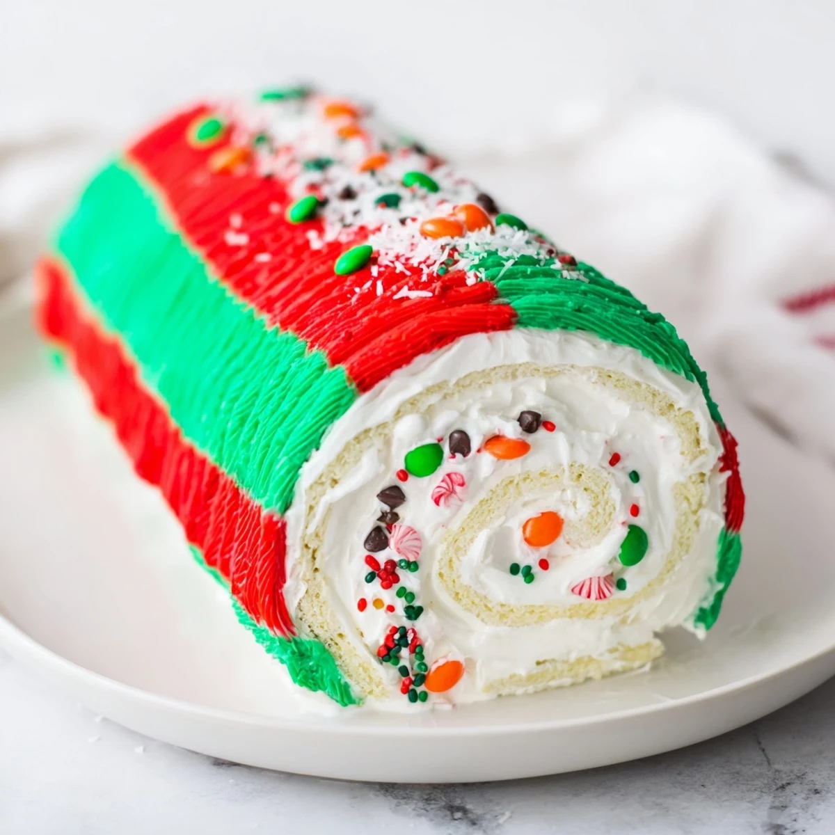 Vibrant Ugly Sweater Cake Roll with colorful frosting and festive sprinkles, perfect for holiday parties.