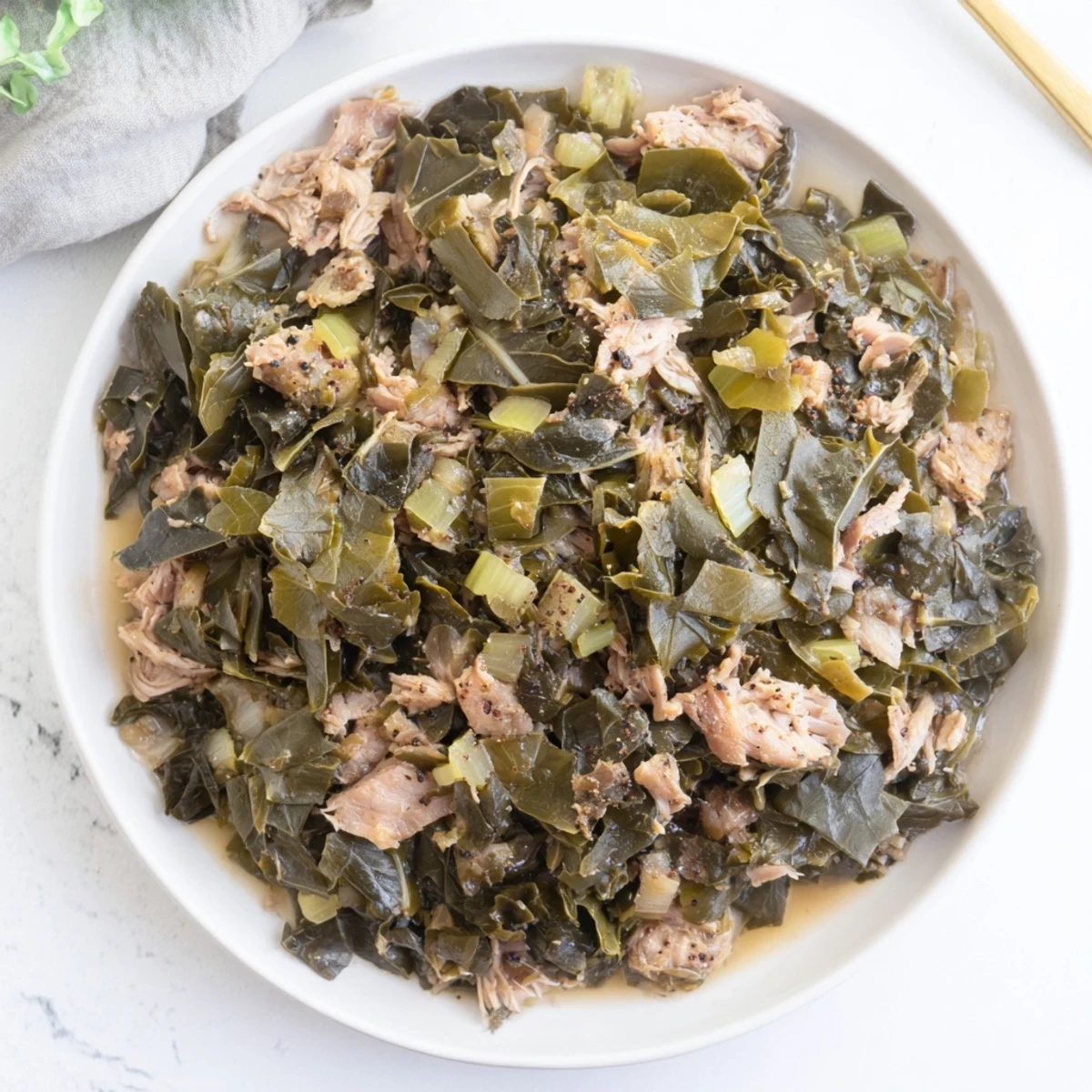 Savory Southern collard greens with smoked turkey, featuring tender greens and smoky flavors.