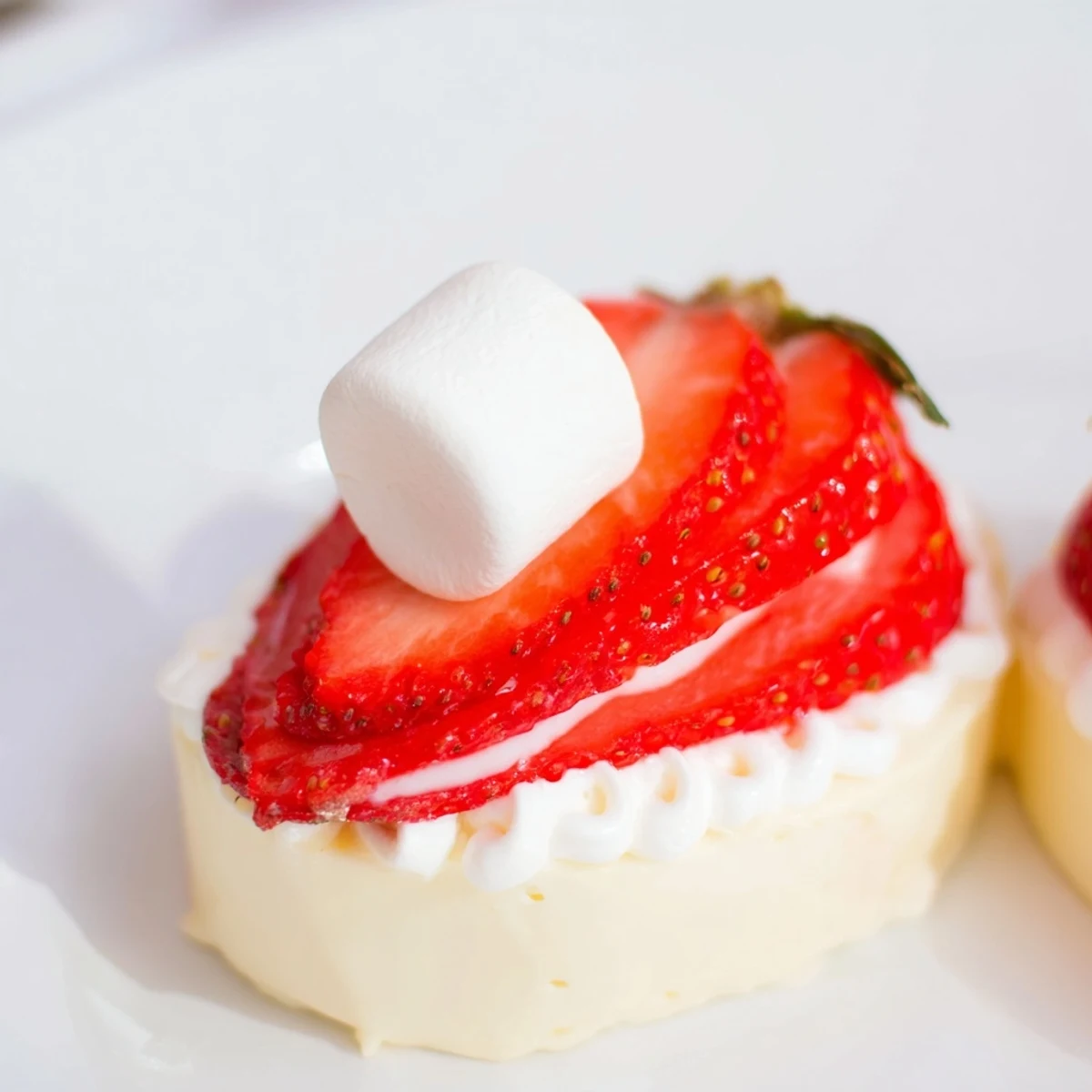 Air Fryer Santa Hat Strawberries, a delightful holiday treat, topped with fluffy marshmallows and white chocolate.