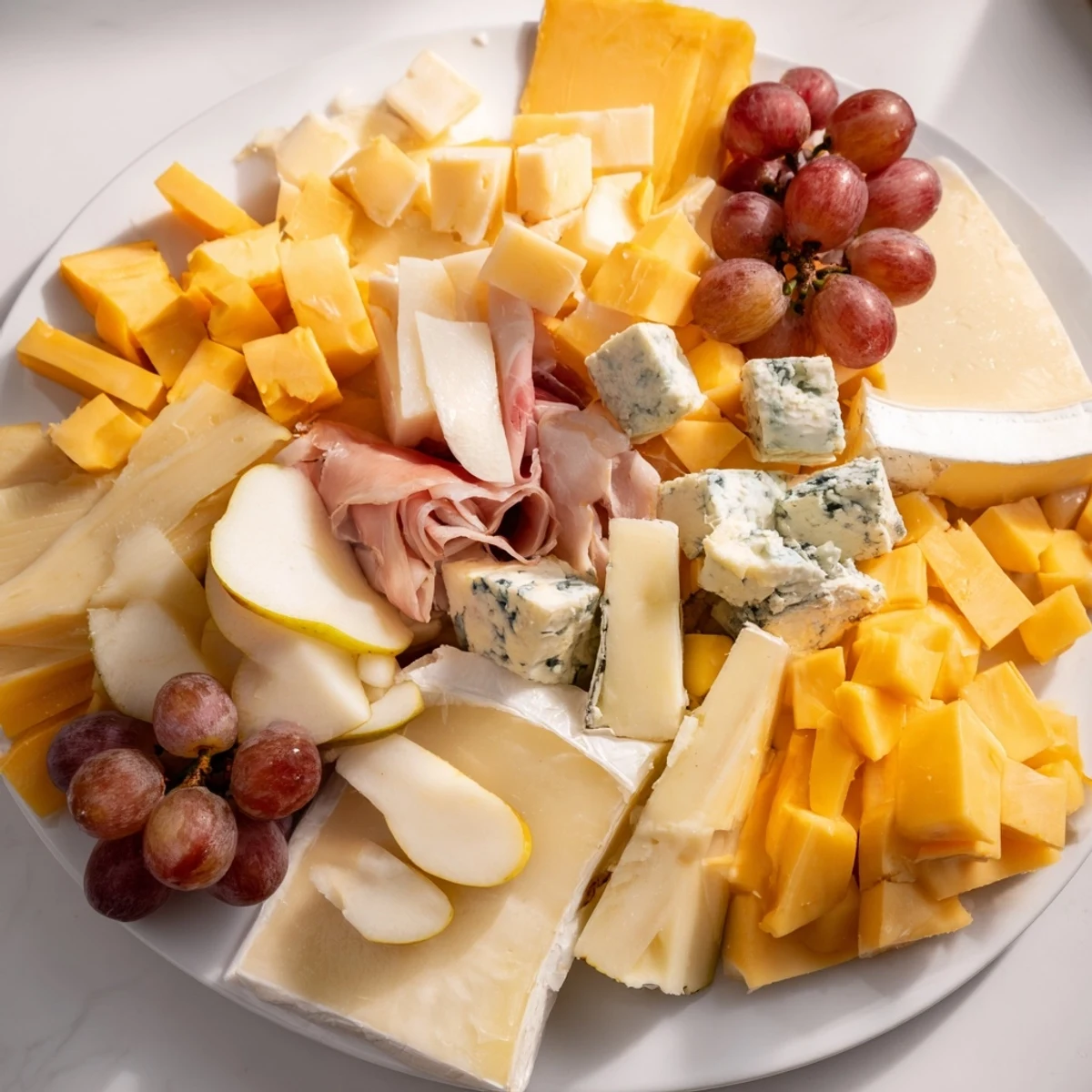 Delectable Sleigh Ride Charcuterie features brie, prosciutto, and seasonal fruits beautifully arranged for holiday entertaining.