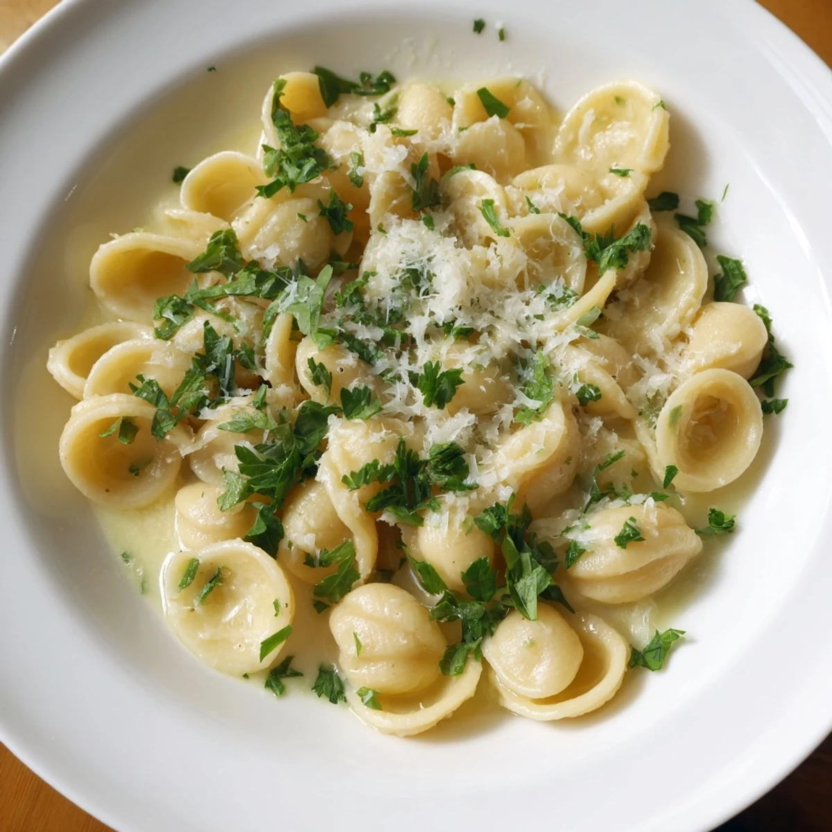 One-Pot Garlic Butter Ditalini, a creamy delight, is garnished with fresh parsley and Parmesan.