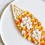 Delectable and artfully arranged Candy Corn Spooky Board, perfect for a festive Halloween appetizer spread.