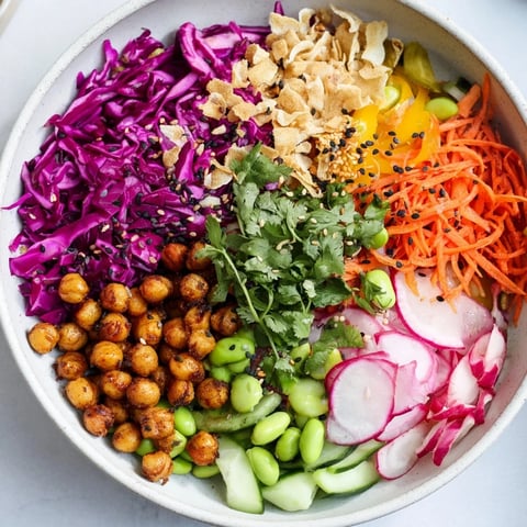 A vibrant ASMR Crunch Snack Bowl filled with colorful veggies and crispy toppings.  