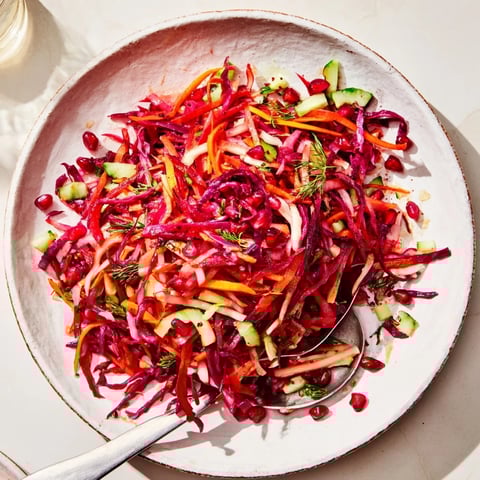 Vibrant Shirazi-Inspired Winter Slaw with crunchy red cabbage and colorful pomegranate seeds, ready to eat!