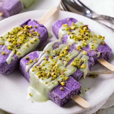 Delicious layered ube & pistachio ice cream bars, a refreshing fusion dessert experience.  
