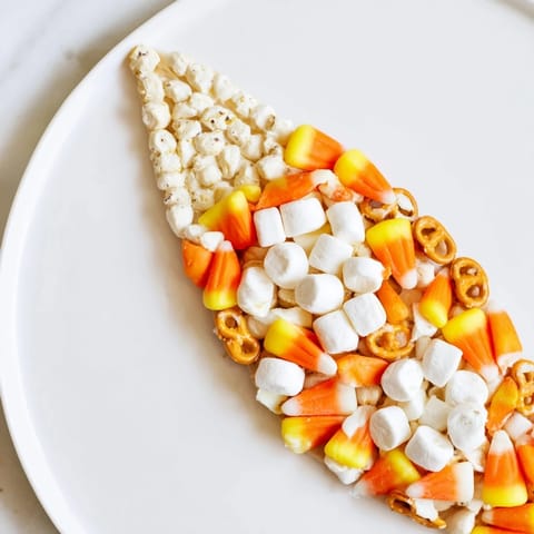 Delectable and artfully arranged Candy Corn Spooky Board, perfect for a festive Halloween appetizer spread.
