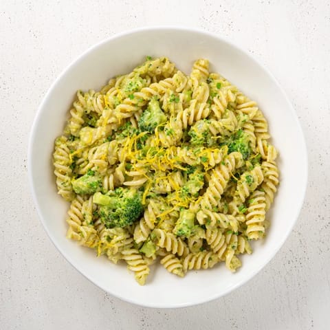 Creamy Green Goddess Broccoli Cheddar One-Pot Pasta, a comforting vegetarian meal served in a bowl.