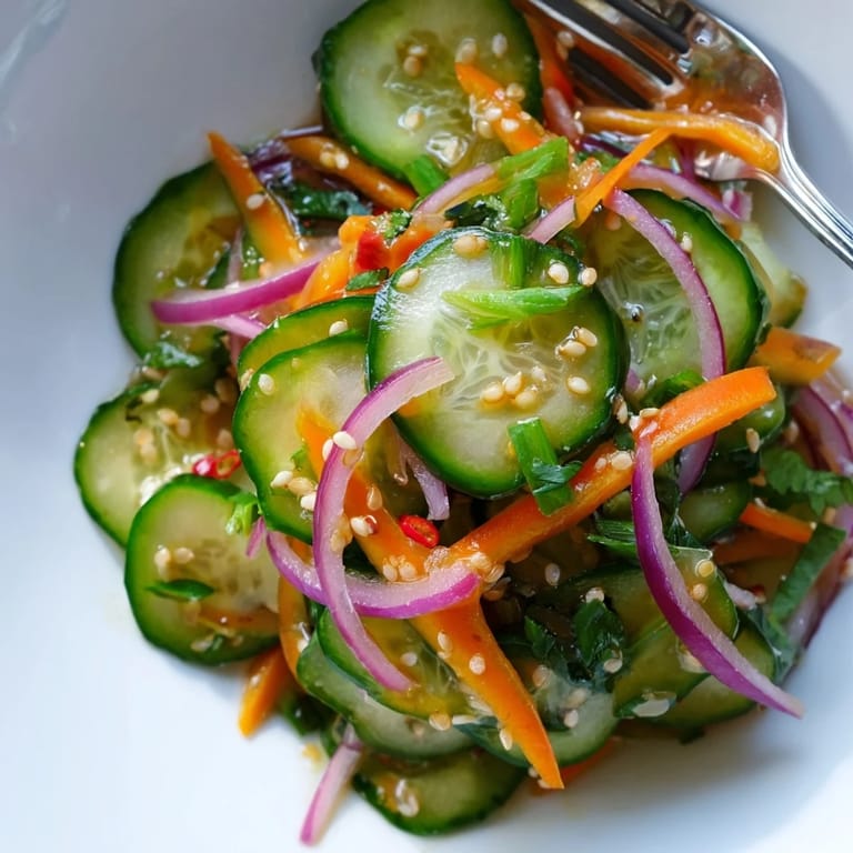 Crisp cucumber salad remix bursting with flavors, perfect as a light appetizer.