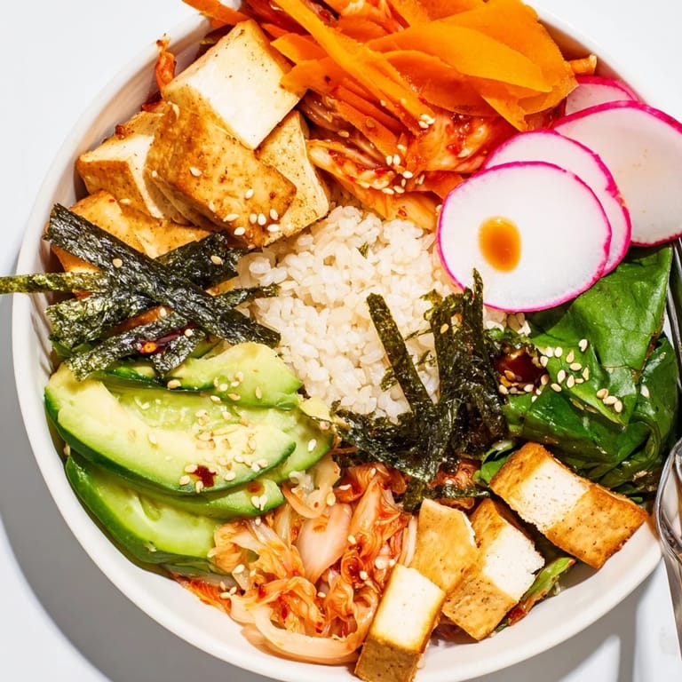 Delicious fermented vegetable bowl topped with crunchy radishes, silky tofu, and sesame seeds.