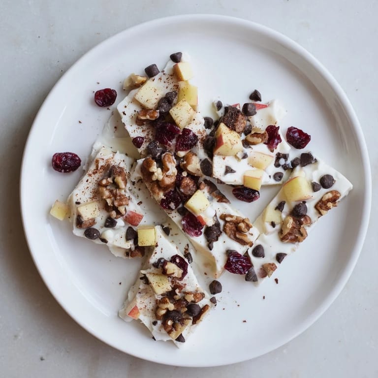 This homemade Apple Cinnamon Yogurt Bark features a vibrant layer of frozen Greek yogurt and fall flavors.