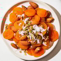 Simple fruit & nut pile: A beautiful arrangement of sweet dried apricots and crunchy almonds ready to enjoy.